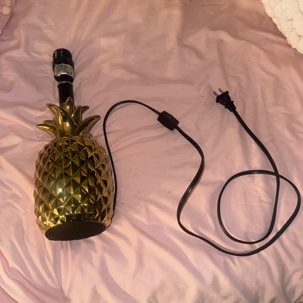 A gold metallic pinapple lamp stand!